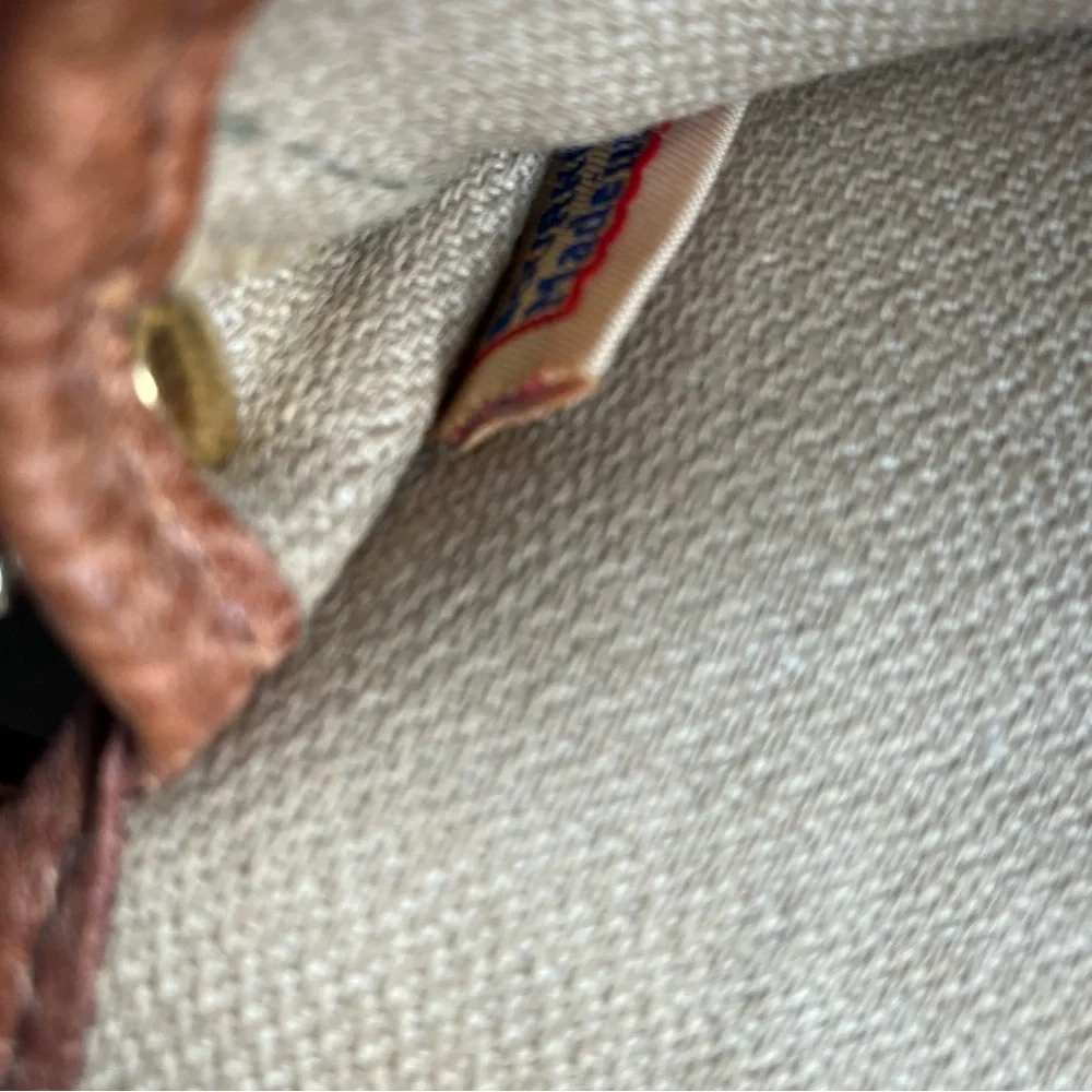 Dooney and Bourke signature logo tan leather and‎ brown monogram fabric wristlet